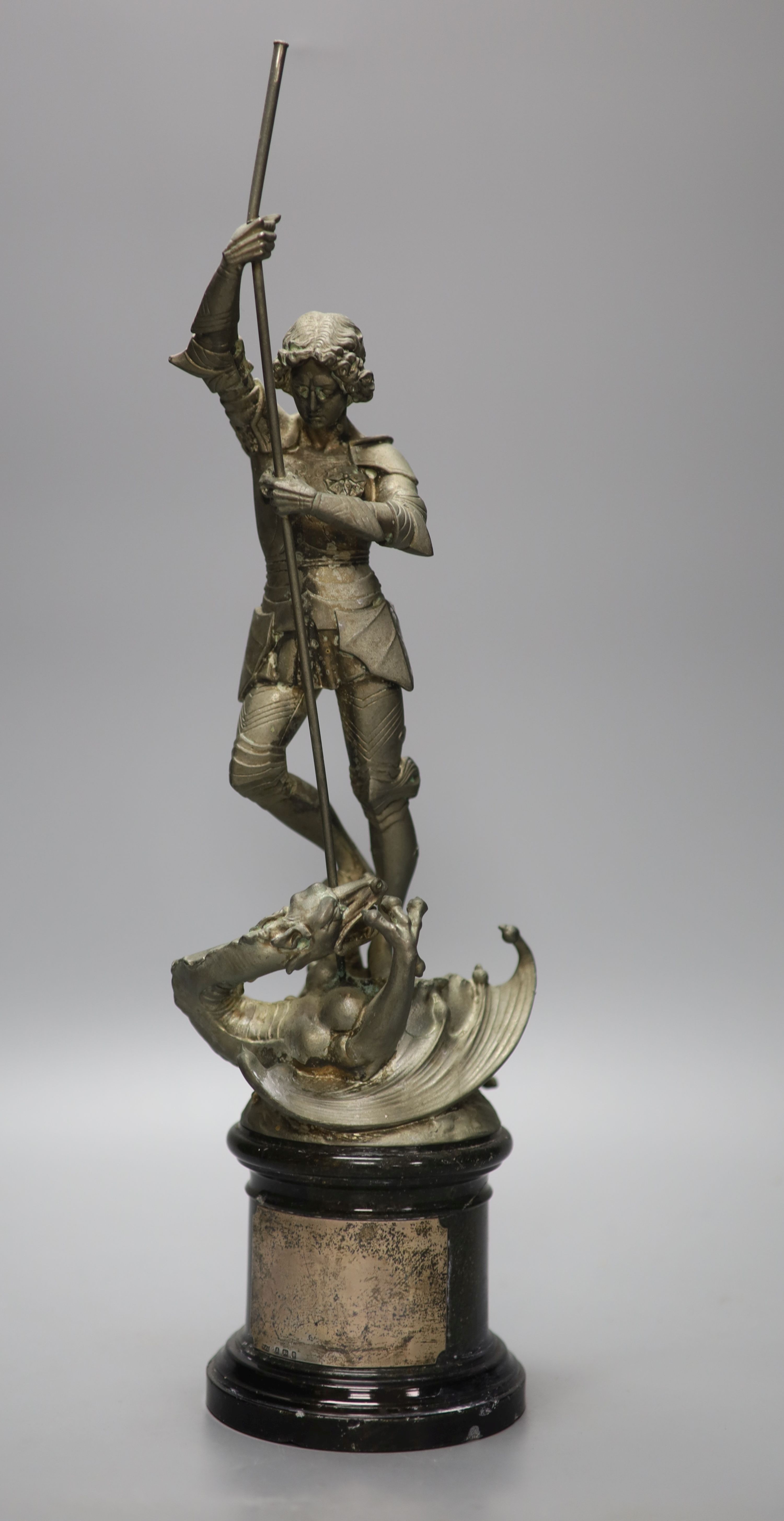 A spelter figure of St George and the Dragon, on turned marble base with vacant silver cartouche, height 41cm